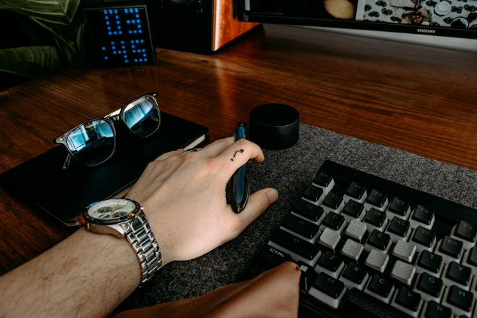 a person is typing on a computer keyboard